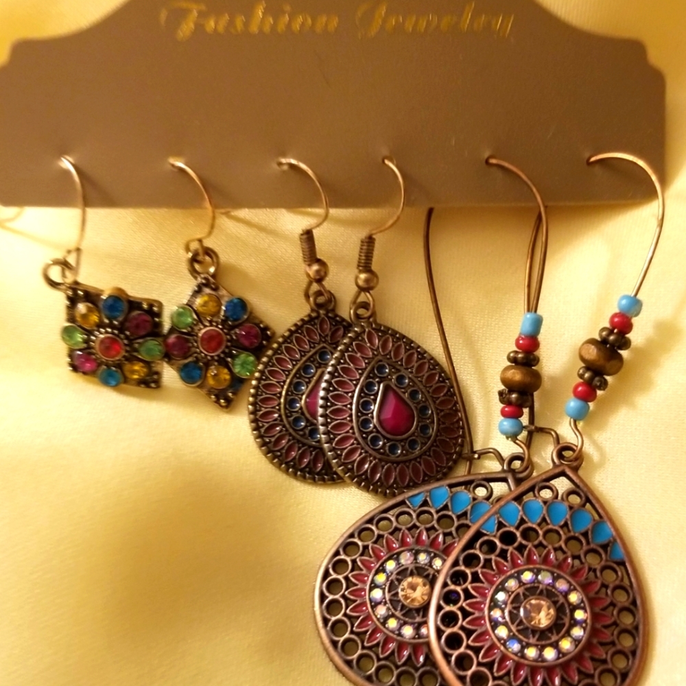 Bohemian lightweight dangling earrings in antiqued metal and delicate detail.